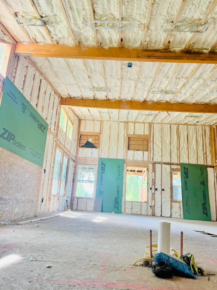 A room with foam insulation on the walls and ceiling.