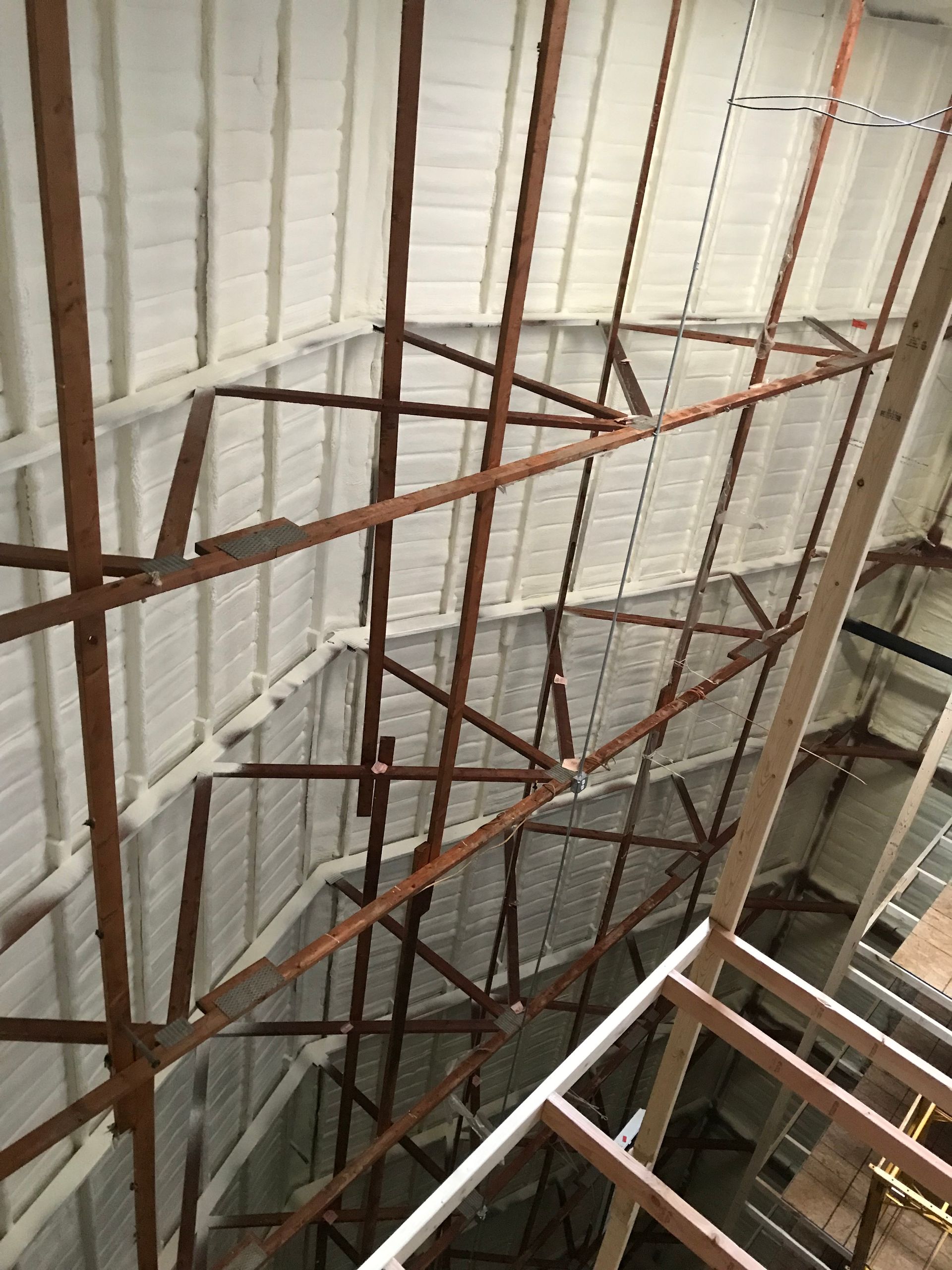 Looking up at the ceiling of a building under construction.